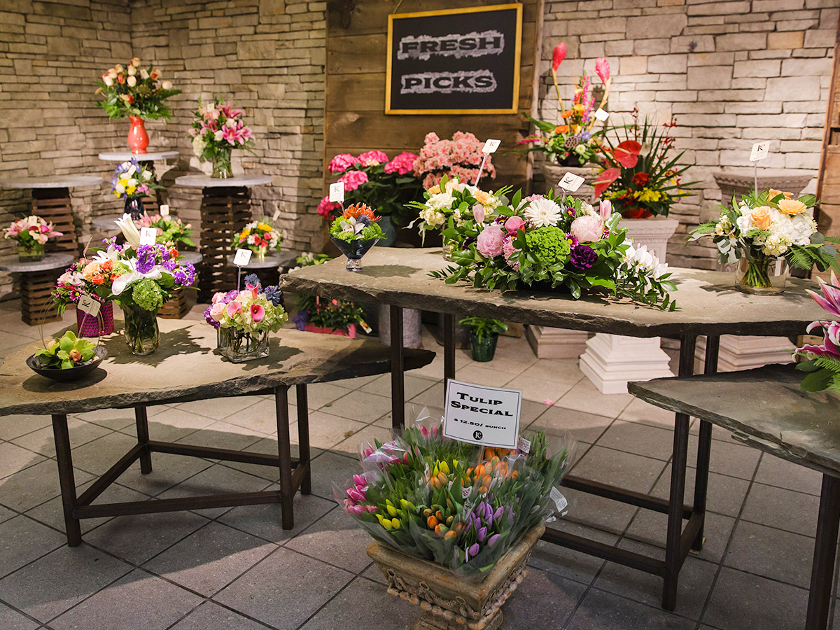 A wide range of colorful floral arrangements, awaiting their new home